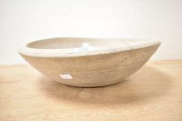 A large 19th-century wooden dough bowl, of an organic form, unmarked, 42cm diameter, condition is