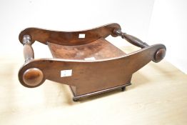 Presumed late 18th to early 19th-century mahogany cheese coaster, featuring scrolled ends