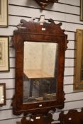 Thought to be Georgian Chippendale-style mahogany wall mirror, featuring a shaped and scalloped