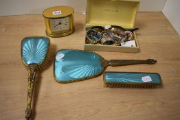 A small collection of costume jewellery, including brooches, a vintage Waltham wristwatch, and a
