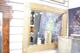 A large late 20th-century regency style gilded framed mirror, of square design, with a reeded