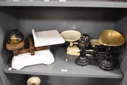 A selection of late 19th to early 20th-century metal, cast iron and brass scales, to feature a