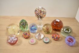 A large quantity of 19th and 20th-century studio glass paperweights, to include a 19th-century