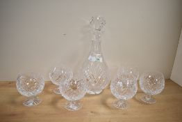 A set of 20th-century Irish Tyrone Crystal ware brandy balloon-style goblets with matching decanter,