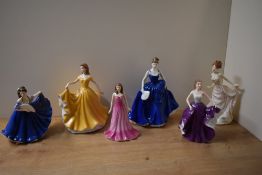 A group of four Royal Doulton bone china figurines comprising 'Elaine' HN 4718, The Gemstones