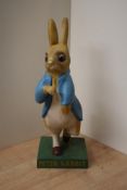 A rare 1950's cast composite Peter Rabbit shop display advertising figure, mounted on square base,