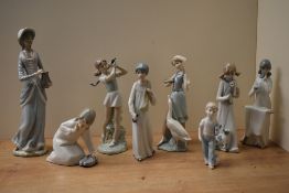 A group of eight Lladro porcelain and similar figures/figurines to include 'Little Girl with