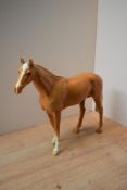 A Beswick Pottery Large Palomino Racehorse study, model number 1564, designed by Arthur Gredington