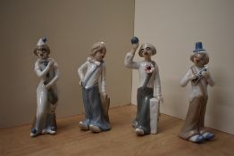 A group of four Casades Spanish porcelain clown figures to include two band members, a violinist and
