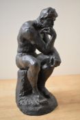 A 20th century resin reproduction of Auguste Rodin's 'The Thinker', no signatures or markings,