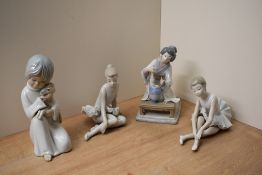 A group of four Lladro and Nao by Lladro and similar porcelain figurines to include 'Flower