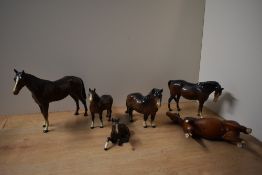 A group of six Beswick Pottery horse studies to include Foal (Lying) model number 915 designed by