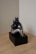 A Devora Jaron contemporary white metal figure group, modelled as a couple embracing, marked D.Jaron