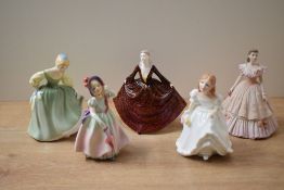 A group of three Royal Doulton bone china figurines comprising 'Babie' HN 1679, 'Fair Maiden' HN
