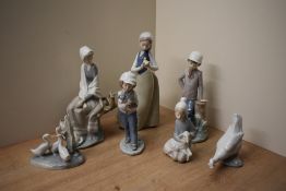 A group of seven Lladro and Nao by Lladro porcelain figures/figurines and animal studies to