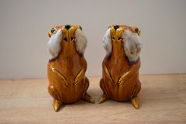 A pair of yellow brown drip glaze pottery gopher studies, no markings or signatures, measure 17cm