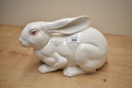 A large 20th century continental porcelain white rabbit, featuring red painted eyes and whiskers,