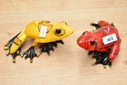 In the style of Tim 'The Frogman' Cotterill (British b.1950) a pair of large resin frog studies,