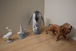 A group of three Lladro and Nao by Lladro porcelain animal studies including 'Penguin Love' model