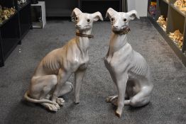 A pair of 20th century large Italian white glazed porcelain greyhound studies, both depicted seated,