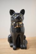 A large pottery fireside cat study, black gloss finish, measures 31cm tall, no markings or