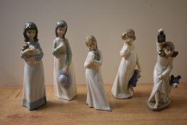 A group of five Nao by Lladro porcelain figurines to include 'My Rag Doll' model number 1108, 'Who