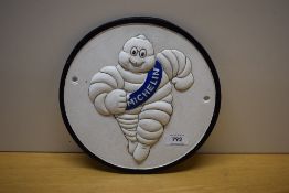 A round Michelin wall plaque in painted cast metal 24cm modern cast repro