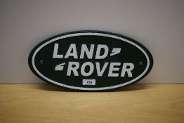 An oval painted cast wall plaque for Landrover 35cm wide
