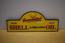 A Guaranteed Shell Lubricating Oil painted cast wall sign 50cm wide
