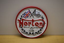 A circular painted cast Norton British Machines since 1898 wall plaque 20cm