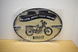 An oval We care about your dream Bullit Motorcycle sign 60cm wide