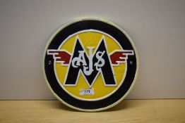 A circular painted AJS cast wall plaque 23cm