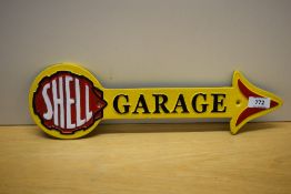 A painted cast Shell Garage arrow 40cm