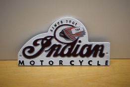 A painted cast sign for Indian Motorcycle 30cm wide