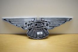 An alloy Jaguar sign