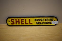 A small painted cast wall plaque for Shell Motor Spirit Sold Here