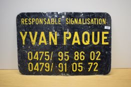 A vintage sign 'respnsable Signage Yvan Paque'