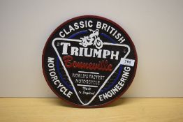 A circular Triumph Bonneville World Fastest Motorcycle Made in England, Classic British British