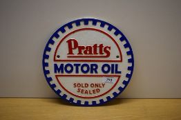 A round Pratts Motor Oil sold only sealed cast wall plaque