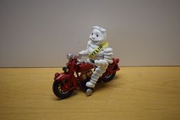 A boxed painted cast Michelin man on a Motorcycle model