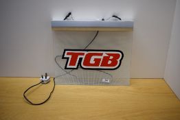 An illuminated TGB sign