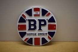 A circular painted cast BP Motor Spirit wall plaque 24cm