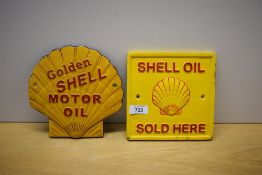 Two Shell painted cast wall plaques. Golden Shell Motor Oil scallop shaped and a square Shell oil