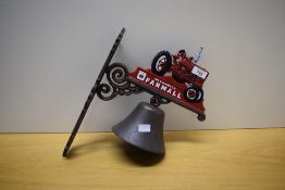 A McCormick Farmall wall mounted door bell