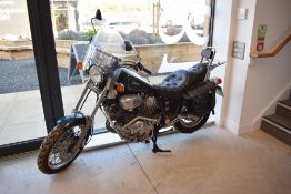 A Yamaha VX750 Virago motorcycle with the odometer reading 6935.