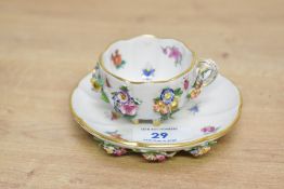 A fine late 19th-century Meissen porcelain flower-encrusted cabinet cup and saucer, having soft