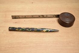 Two 20th-century Bakelite items including one tape measure and one knitting needle, smooth marbled