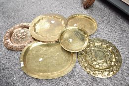 Three presumed 20th-century copper and brass Islamic Kashmir-style chargers, all featuring intricate