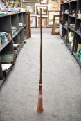 A long 20th-century copper and brass hunting horn, unmarked, 122cm, condition is consistent with age