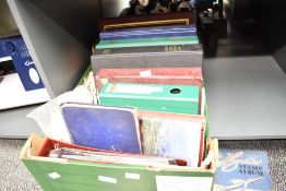 A large selection of stamps, some in albums and some loose, pertaining to Great Britain and